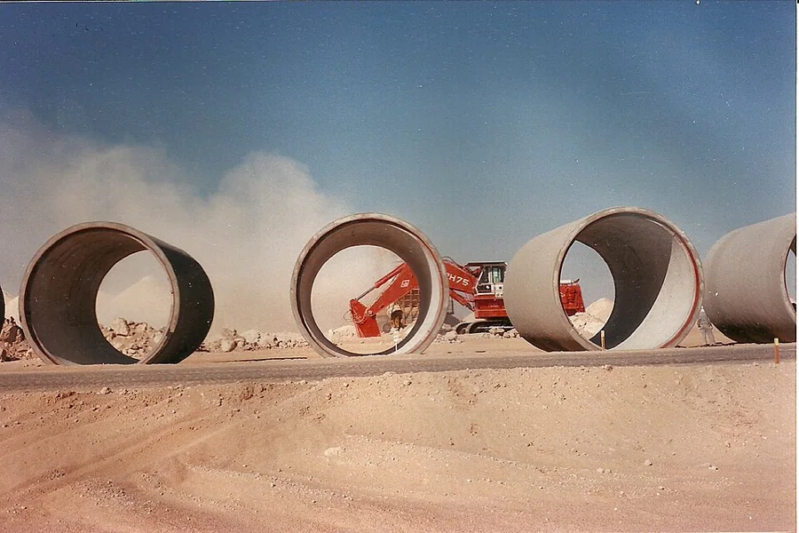 Large concrete pipe sections on a work site